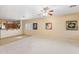 Bright living room with a ceiling fan and seamless access to the open kitchen area at 3766 W Jacksonville Dr, Anthem, AZ 85086