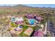 Community pool and water slides with surrounding lounge areas at 3766 W Jacksonville Dr, Anthem, AZ 85086