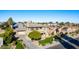 An aerial view of a two-story house with a landscaped yard and a neighborhood in the background at 3798 E Latham Ct, Gilbert, AZ 85297