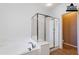 Bright bathroom boasts a soaking tub with tile surround and separate glass enclosed shower at 3798 E Latham Ct, Gilbert, AZ 85297