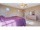 Comfortable bedroom with a double dresser and large windows at 3798 E Latham Ct, Gilbert, AZ 85297