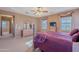 Well-lit bedroom with wooden furnishings and a large window at 3798 E Latham Ct, Gilbert, AZ 85297