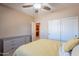 Bedroom with double doors and ceiling fan at 3798 E Latham Ct, Gilbert, AZ 85297