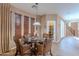 Bright breakfast nook features a glass-top table and wicker chairs at 3798 E Latham Ct, Gilbert, AZ 85297