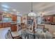 Bright dining area with glass-top table and kitchen access at 3798 E Latham Ct, Gilbert, AZ 85297