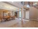 Formal dining room with a large wooden table and a view to the entry at 3798 E Latham Ct, Gilbert, AZ 85297