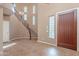 Grand entryway with a curved staircase and tiled flooring at 3798 E Latham Ct, Gilbert, AZ 85297