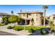 Two-story house with a front yard, driveway, and palm trees at 3798 E Latham Ct, Gilbert, AZ 85297