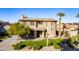 Two-story house with a front yard, driveway, and palm trees at 3798 E Latham Ct, Gilbert, AZ 85297