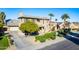 Two-story house with a front yard, driveway, and palm trees at 3798 E Latham Ct, Gilbert, AZ 85297