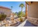 Ornate fountain in front yard with palm trees and landscaping at 3798 E Latham Ct, Gilbert, AZ 85297