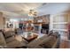 Open concept Gathering room with stone fireplace and kitchen views at 3798 E Latham Ct, Gilbert, AZ 85297