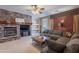 Gathering room features a stone fireplace and built-in shelving at 3798 E Latham Ct, Gilbert, AZ 85297