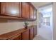 Built-in wooden cabinets and shelving in the home office at 3798 E Latham Ct, Gilbert, AZ 85297