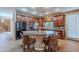 Spacious kitchen with an island, granite countertops, and dark wood cabinets at 3798 E Latham Ct, Gilbert, AZ 85297