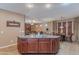 Island kitchen with granite countertops and dark wood cabinets at 3798 E Latham Ct, Gilbert, AZ 85297