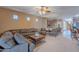 Comfortable living room with sectional sofa and ceiling fan at 3798 E Latham Ct, Gilbert, AZ 85297