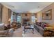 Inviting living room with a stone fireplace and ample seating at 3798 E Latham Ct, Gilbert, AZ 85297