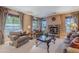 Cozy living room with stone fireplace and comfortable seating at 3798 E Latham Ct, Gilbert, AZ 85297