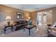 Relaxing living room features a sofa, chairs, and a coffee table at 3798 E Latham Ct, Gilbert, AZ 85297