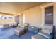 Covered patio with wicker furniture and fire pit table at 3798 E Latham Ct, Gilbert, AZ 85297