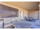 Covered patio with wicker furniture and fire pit table at 3798 E Latham Ct, Gilbert, AZ 85297