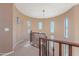 Open upper hallway with windows and curved railing at 3798 E Latham Ct, Gilbert, AZ 85297