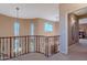 Open upper landing with a curved railing overlooking the entryway at 3798 E Latham Ct, Gilbert, AZ 85297