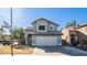 Two-story house with attached garage and desert landscaping at 3935 E Rockwood Dr, Phoenix, AZ 85050