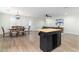 Dining area with wooden table and chairs, and a modern chandelier at 410 E Lincoln Ave, Coolidge, AZ 85128