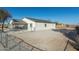 Newly built home with a covered carport and a gravel driveway at 410 E Lincoln Ave, Coolidge, AZ 85128