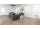 Living room with hardwood floors and access to other rooms at 410 E Lincoln Ave, Coolidge, AZ 85128