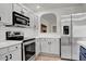 Modern kitchen with stainless steel appliances and white shaker cabinets at 4111 E Tether Trl, Phoenix, AZ 85050