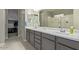 Modern bathroom with double vanity and walk-in shower at 42206 W Capistrano Dr, Maricopa, AZ 85138