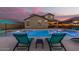 Relaxing pool view with lounge chairs at 42206 W Capistrano Dr, Maricopa, AZ 85138