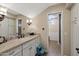 Elegant bathroom with a granite countertop and walk-in shower at 4531 E Cholla St, Phoenix, AZ 85028