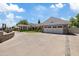 Stone house with a two-car garage and a long driveway at 4531 E Cholla St, Phoenix, AZ 85028