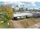 Single level home with large backyard, driveway, and mature trees at 4601 N 75Th St, Scottsdale, AZ 85251