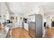 Galley kitchen with stainless steel refrigerator and granite countertops at 4601 N 75Th St, Scottsdale, AZ 85251