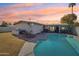 Stunning sunset view of the home and pool area at 4601 N 75Th St, Scottsdale, AZ 85251