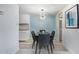 Dining area with a four-person table and light blue accent wall at 6120 N 79Th St, Scottsdale, AZ 85250