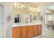 Bathroom with double sinks, a large mirror and a walk-in shower at 6569 W Yorktown Ct, Florence, AZ 85132