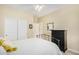 Bedroom with a metal bed frame, dresser and ceiling fan at 6569 W Yorktown Ct, Florence, AZ 85132