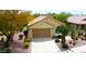 Single-story home with desert landscaping and a two-car garage at 6569 W Yorktown Ct, Florence, AZ 85132