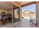 Covered patio with access to backyard, fire pit, and seating area at 6592 E Casa De Leon Ln, Gold Canyon, AZ 85118