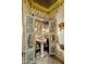 Small bathroom with a pedestal sink and ornate cabinet at 66 Biltmore Est, Phoenix, AZ 85016