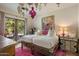 Bedroom with twin beds and access to the backyard at 66 Biltmore Est, Phoenix, AZ 85016