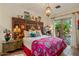 Bedroom with ornate headboard and access to a private patio at 66 Biltmore Est, Phoenix, AZ 85016