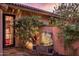 Charming courtyard with a stone fountain and lush landscaping at 66 Biltmore Est, Phoenix, AZ 85016