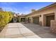 Spacious driveway and two-car garage with Mediterranean architecture at 66 Biltmore Est, Phoenix, AZ 85016